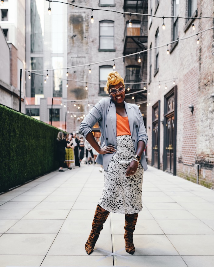 A model rehearses poses on a rooftop terrace in New York City