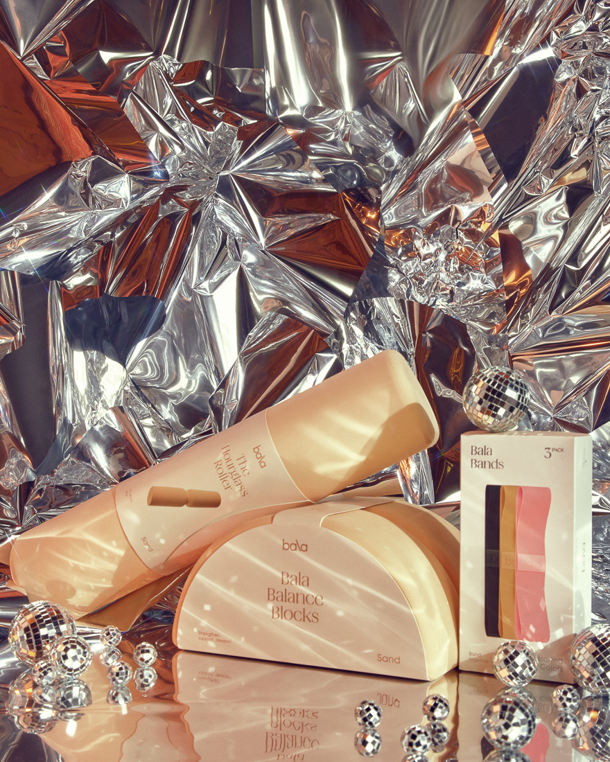 The Suite of Bala products styled for holiday with a mylar backdrop