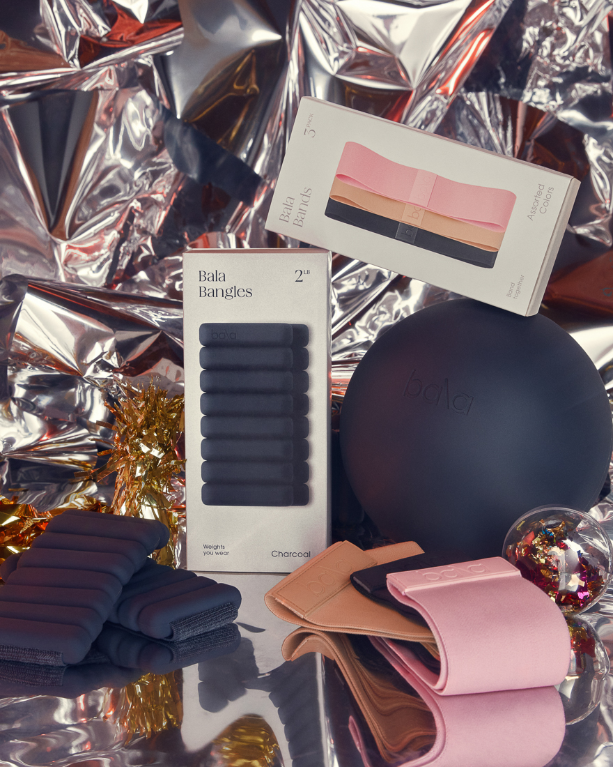 The Suite of Bala products styled for holiday with a mylar backdrop