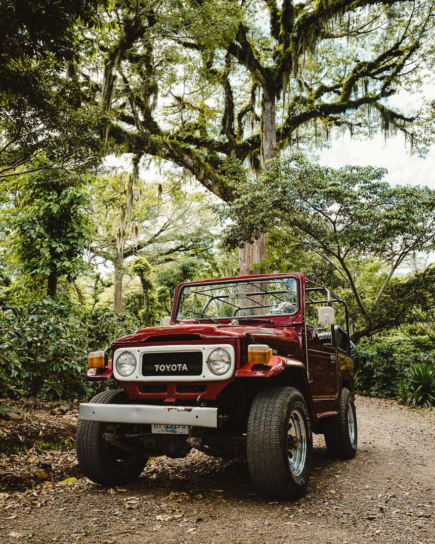 A vintage Toyota driving in Nicaragua