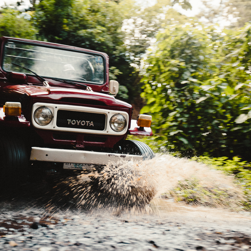 A vintage Toyota driving in Nicaragua