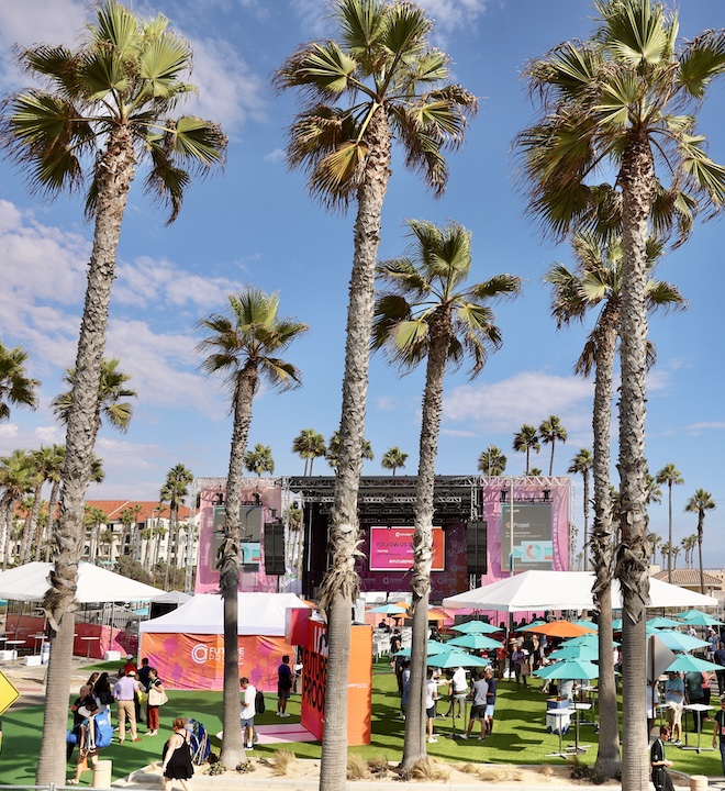 Palm trees and exhibition booths in Huntington Beach, CA for the FutureProof Finance Festival
