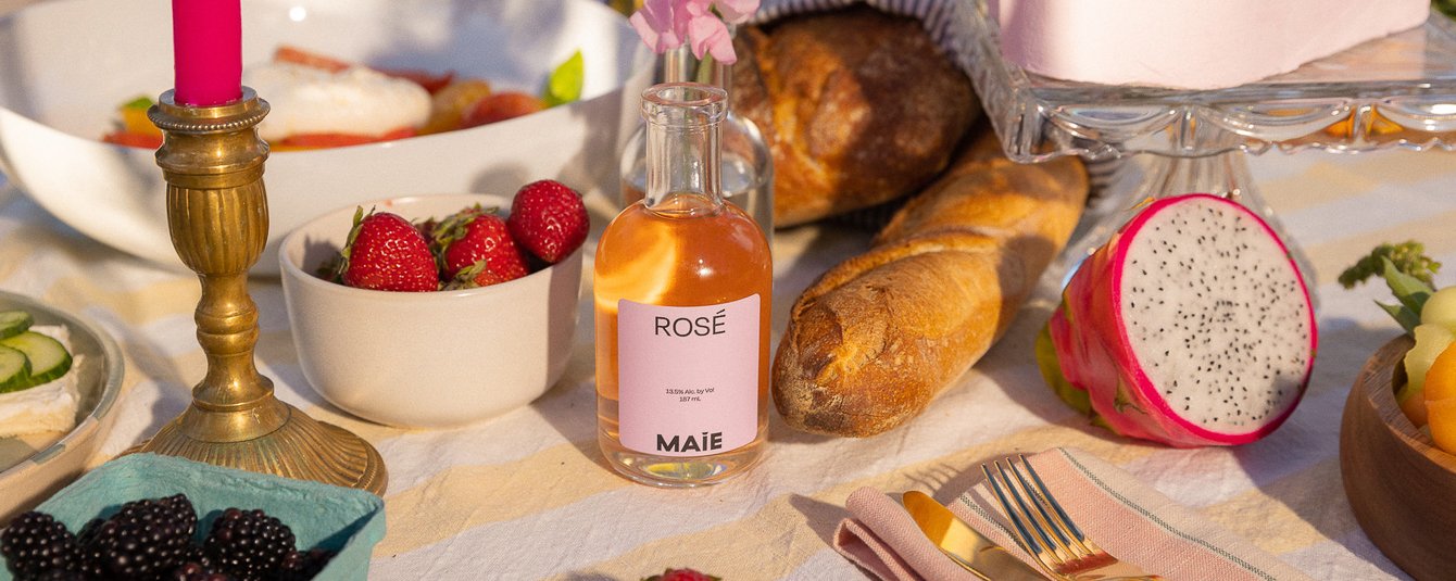 A bottle of Maie Wines on a styled table