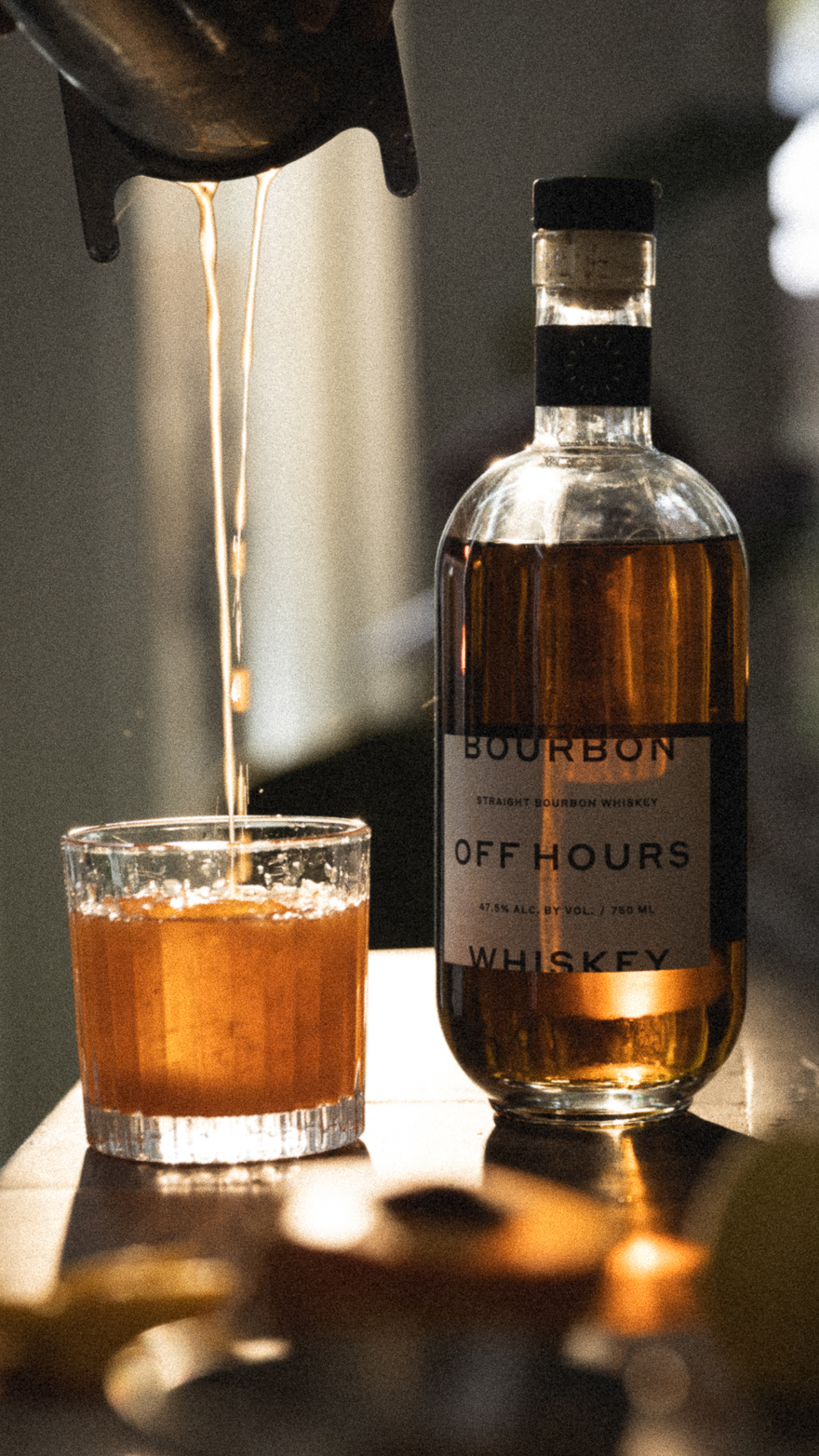 Pouring an old fashioned into a vintage cut crystal glass