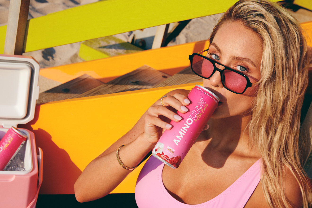 Alix Earle posing with Aminolean Berry Alixer