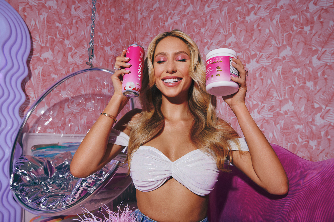 Alix Earle posing with Aminolean pre-workout