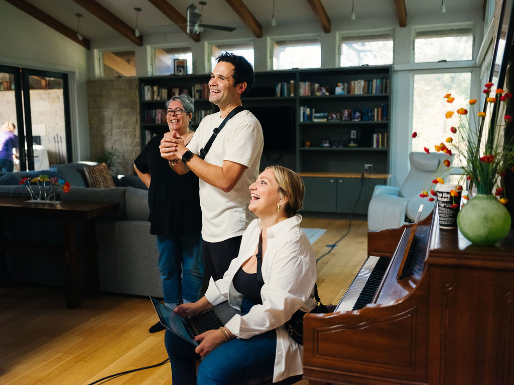 Chris Olfers and Arielle Olfers looking on as The Southern Influence team films a Superbowl commercial for Ollie