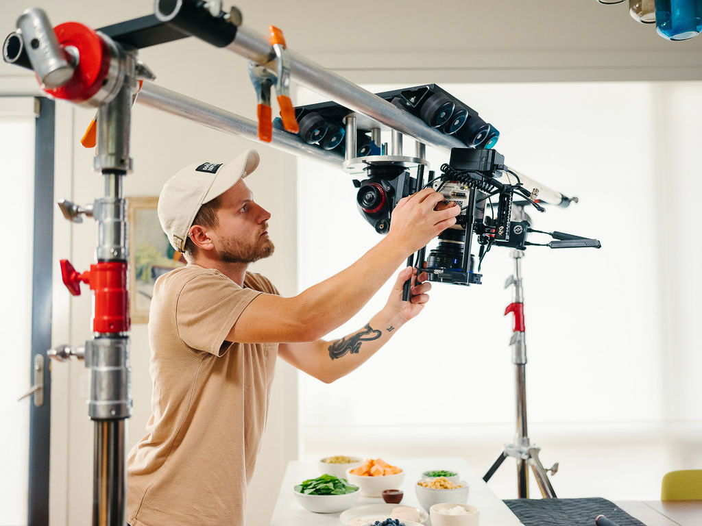 Brian Pfaff setting up cameras and lighting