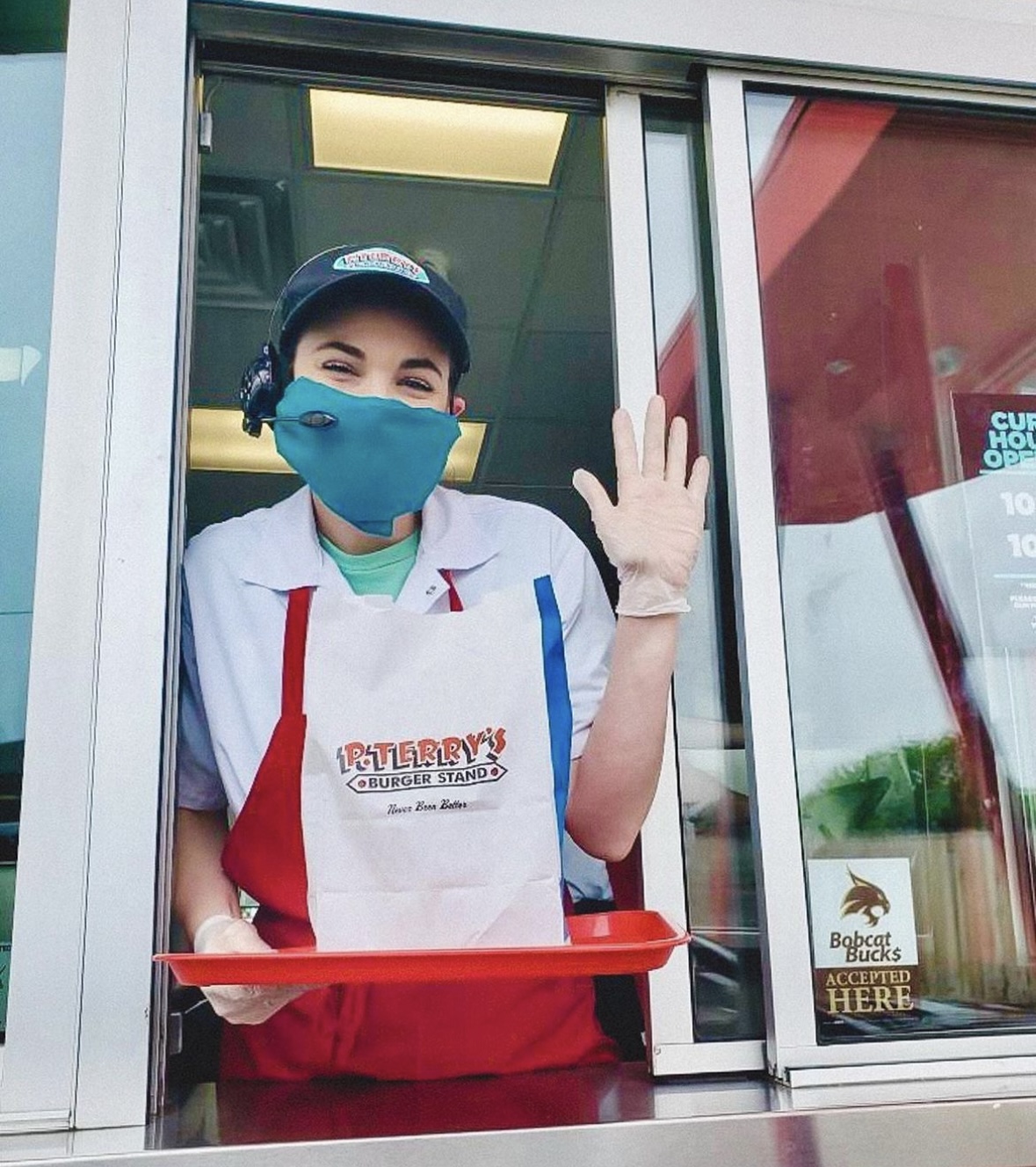 An employee working the drive-thru at P. Terry's