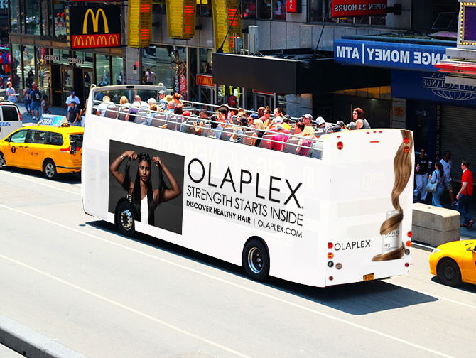 A mock-up of a passenger bus featuring Olaplex on the side