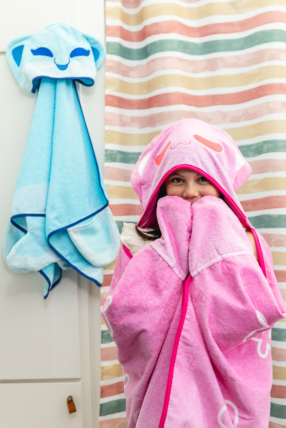 A kid with Catface hooded towels
