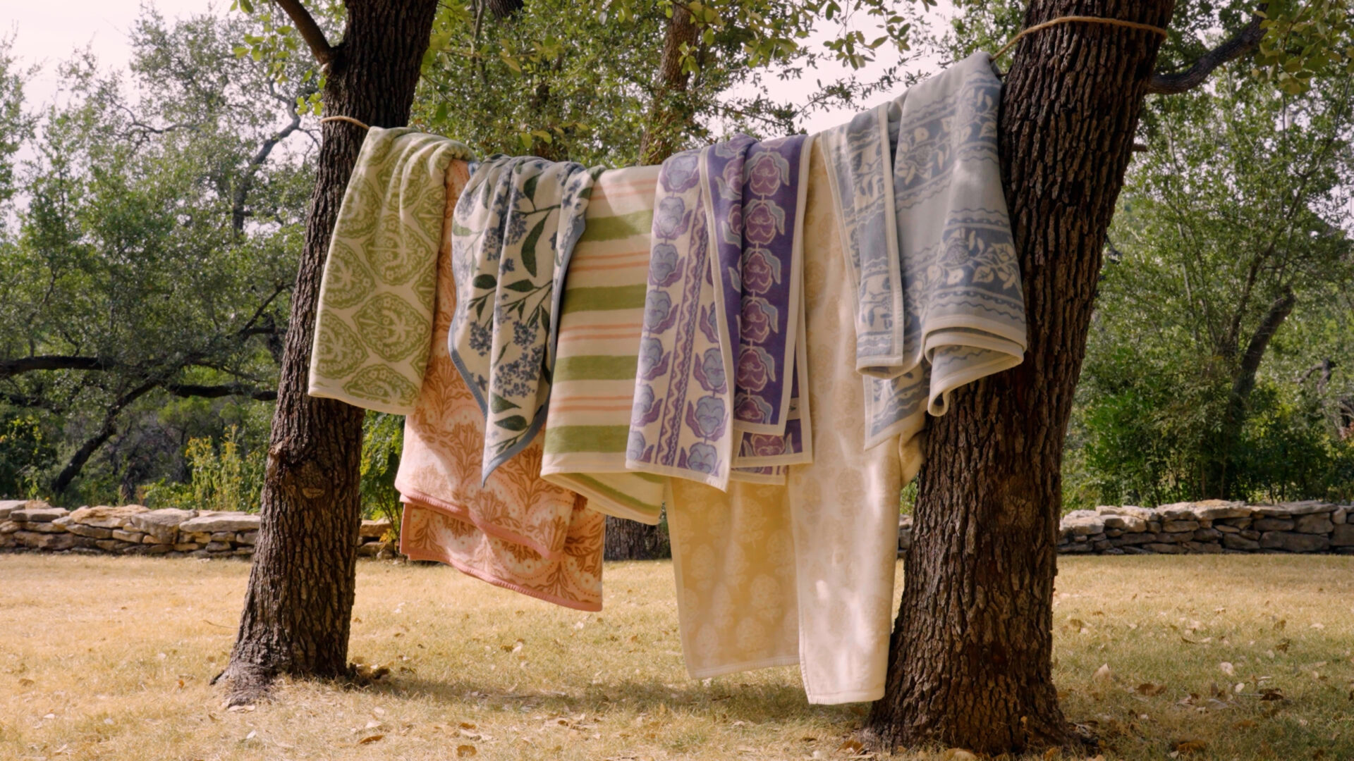 Chappywrap blankets hanging on a clothes line in a field