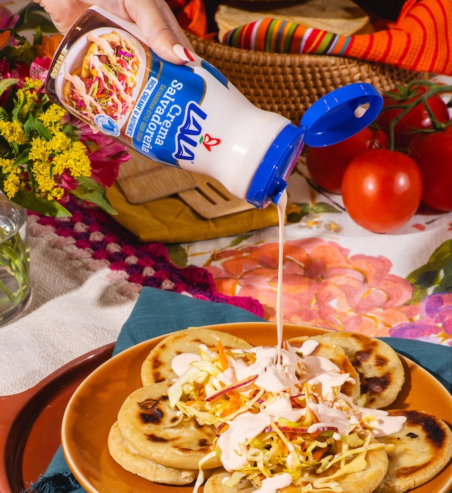 A traditional spread of Mexican food with Lala Salvadoran crema
