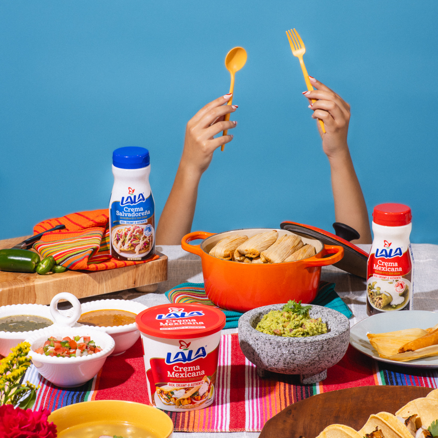 A styled table spread of Mexican food with Lala crema Mexicana