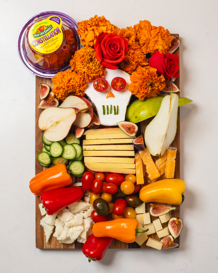 A charcuterie board featuring Nature Sweet vegetables