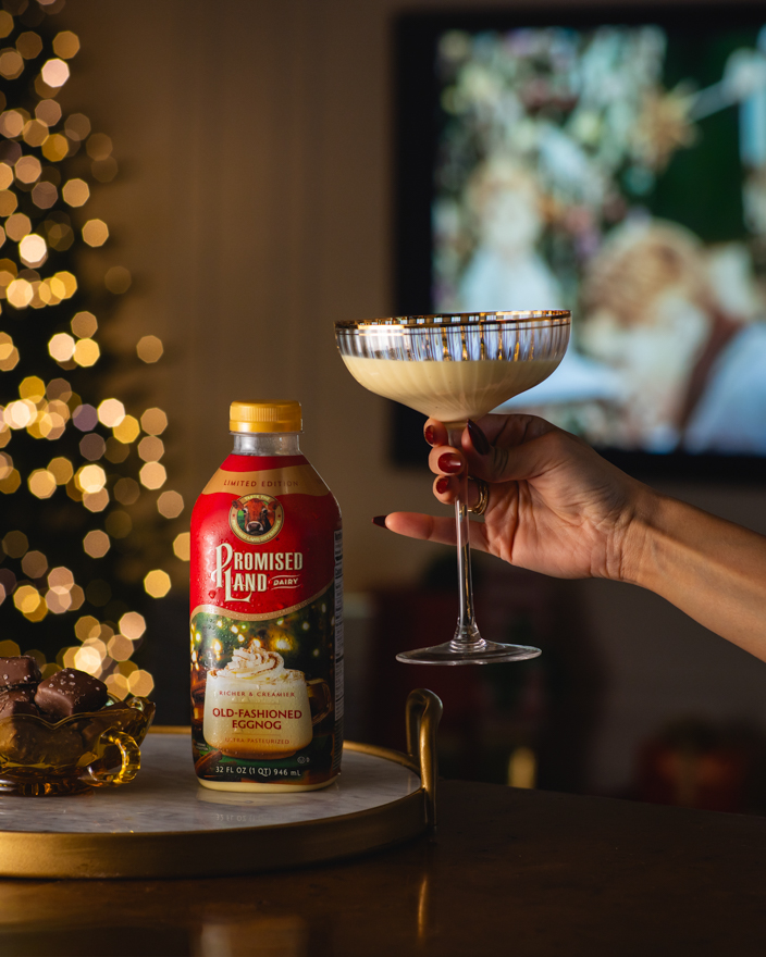 Promised Land Dairy eggnog in a living room decorated for Christmas