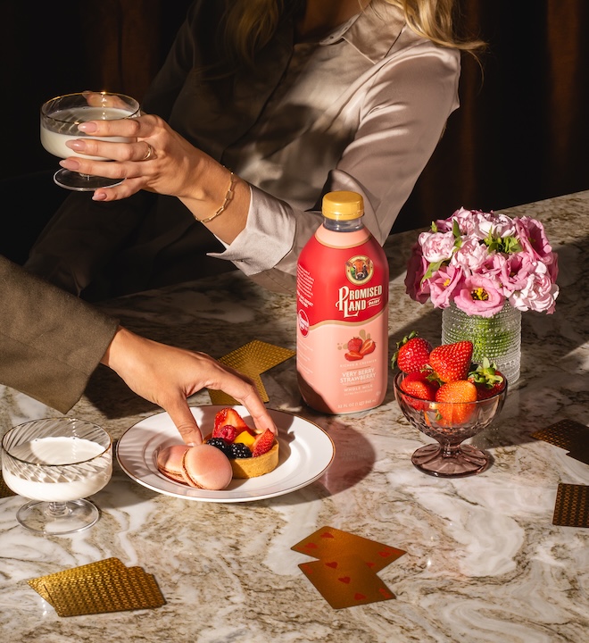 Promised Land Dairy milk on a counter with girls enjoying desserts