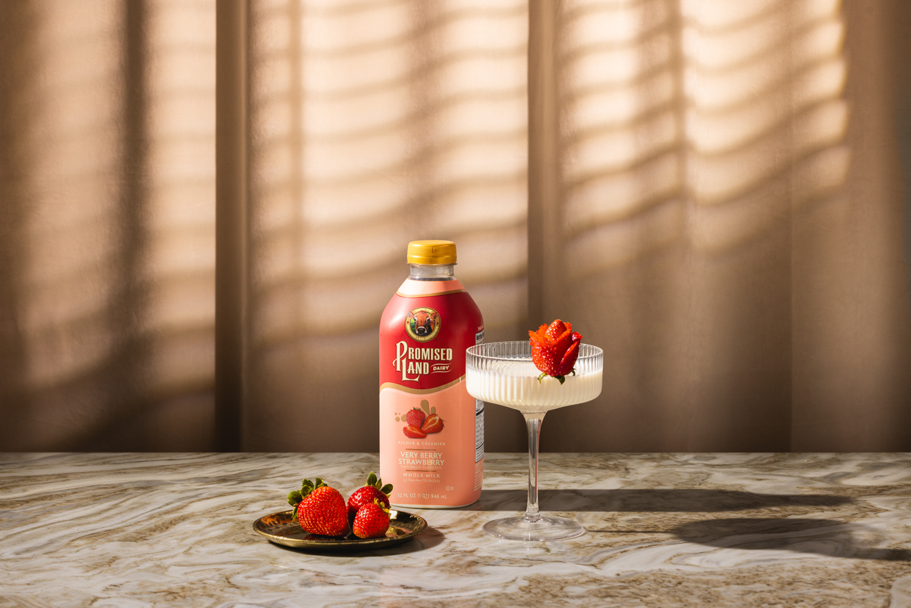 Promised Land Dairy strawberry milk styled product photo 