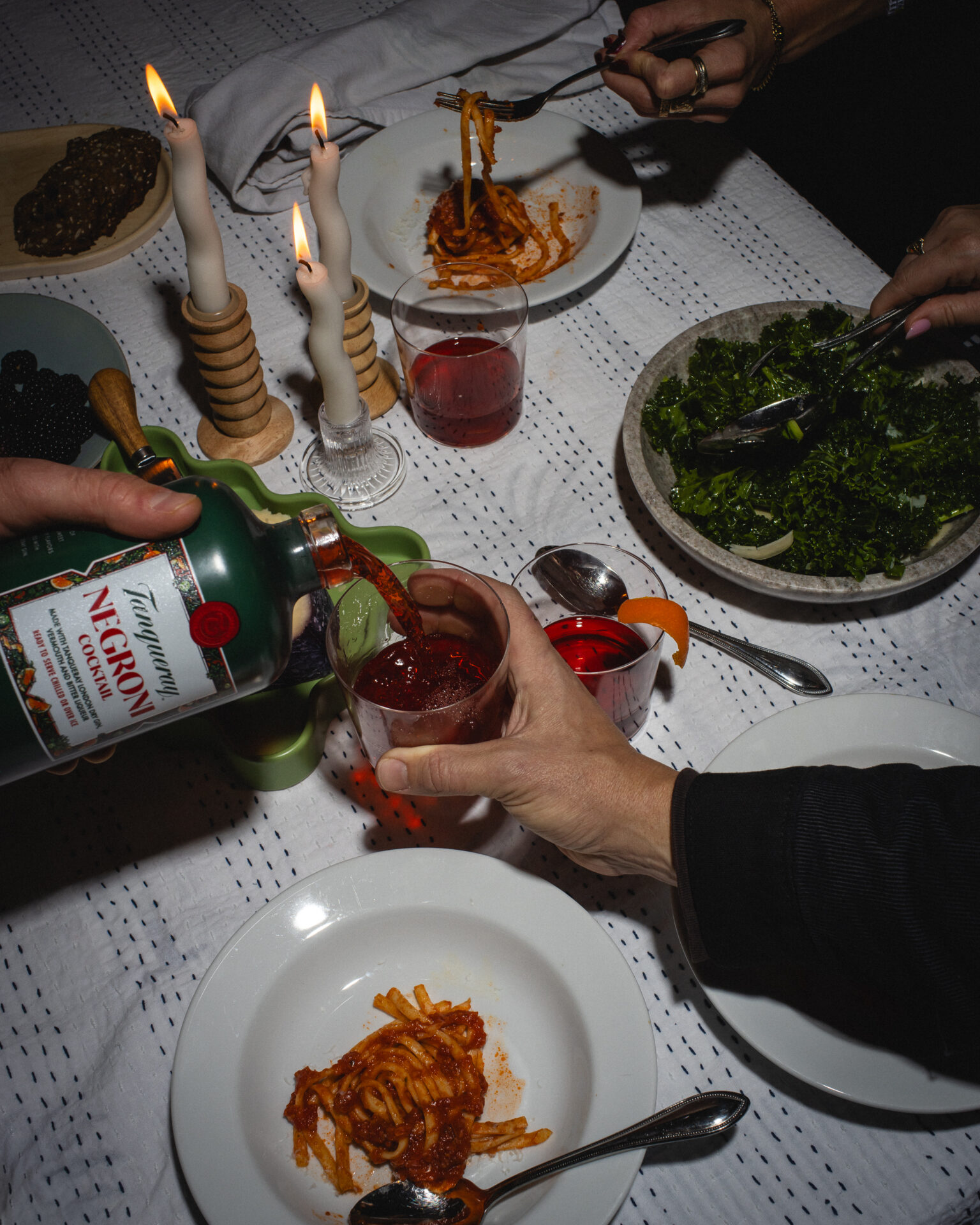 The Cocktail Collection negroni being poured at a dinner party