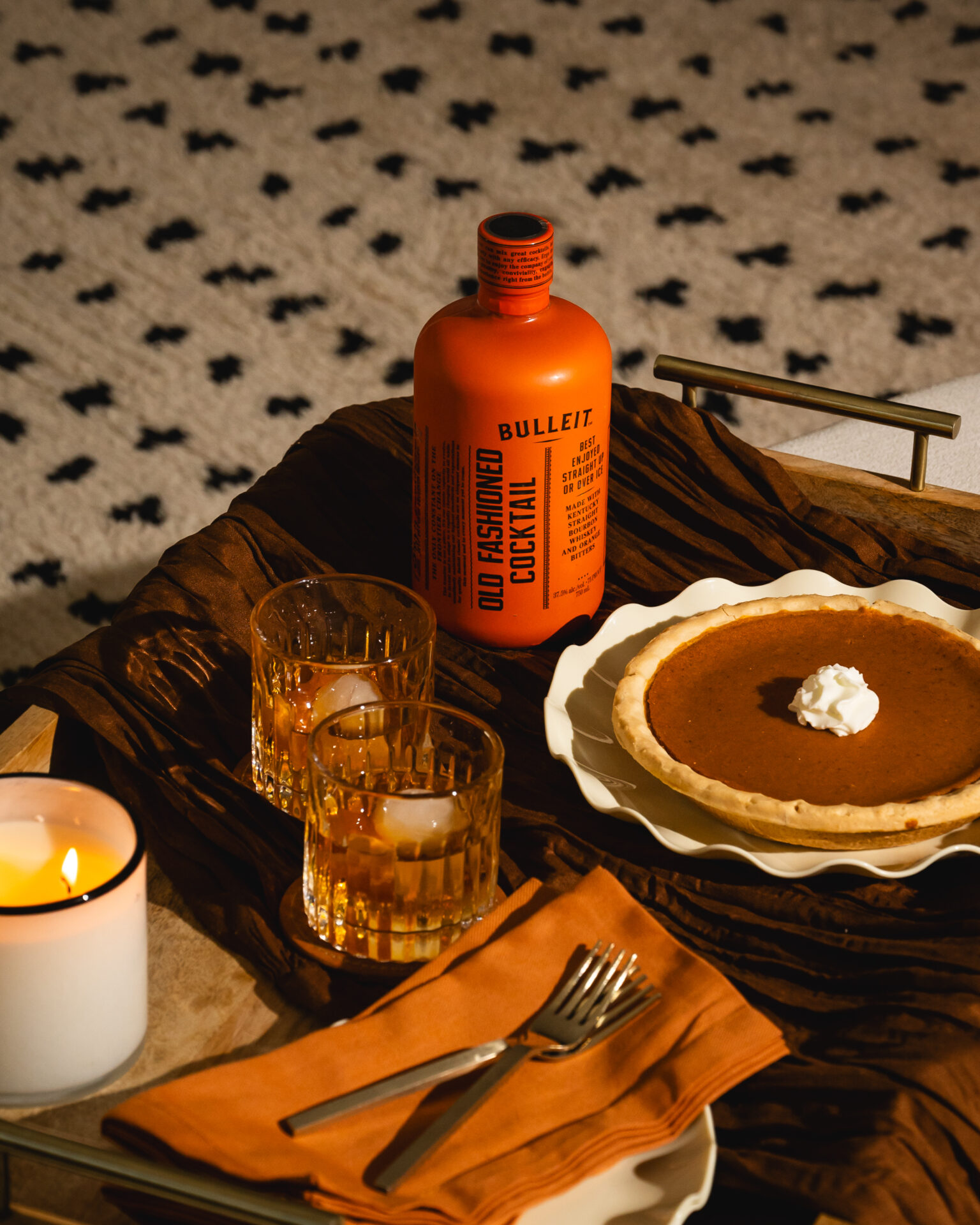 Pumpkin pie and an old fashioned in a living room