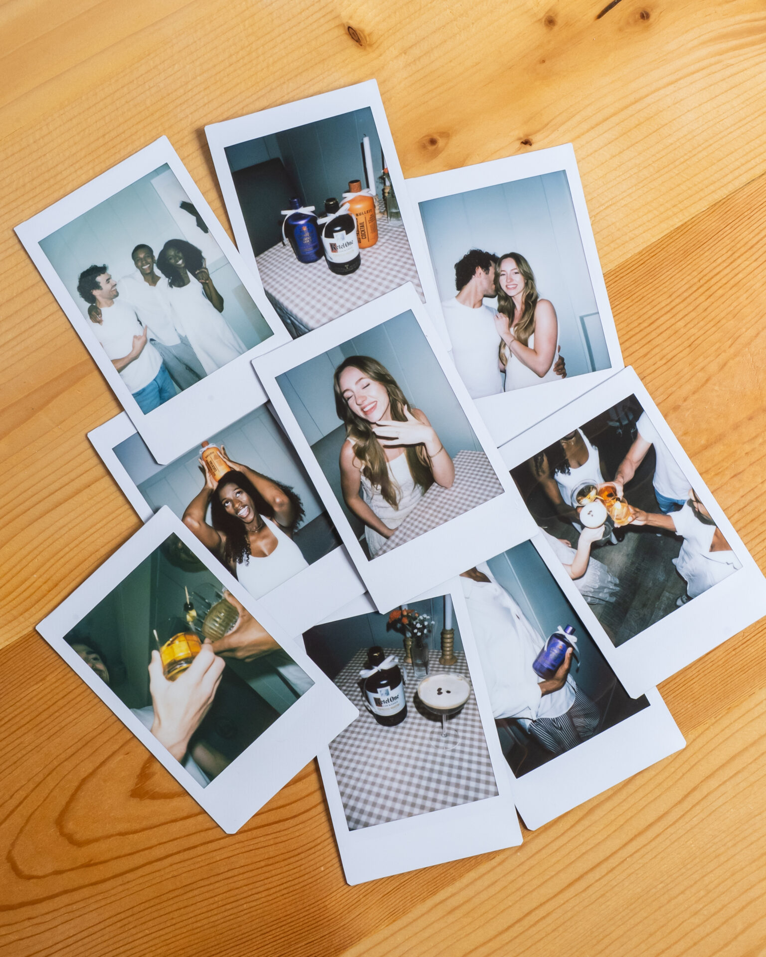 Polaroids from a party on a table