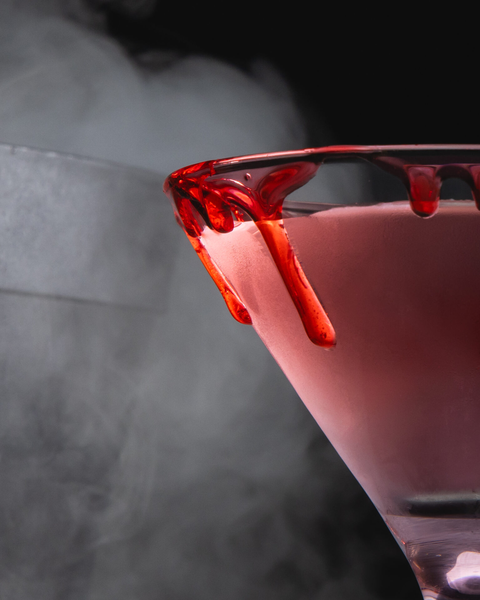 A spooky Halloween-themed still-life featuring The Cocktail Collection Ketel One cosmopolitan