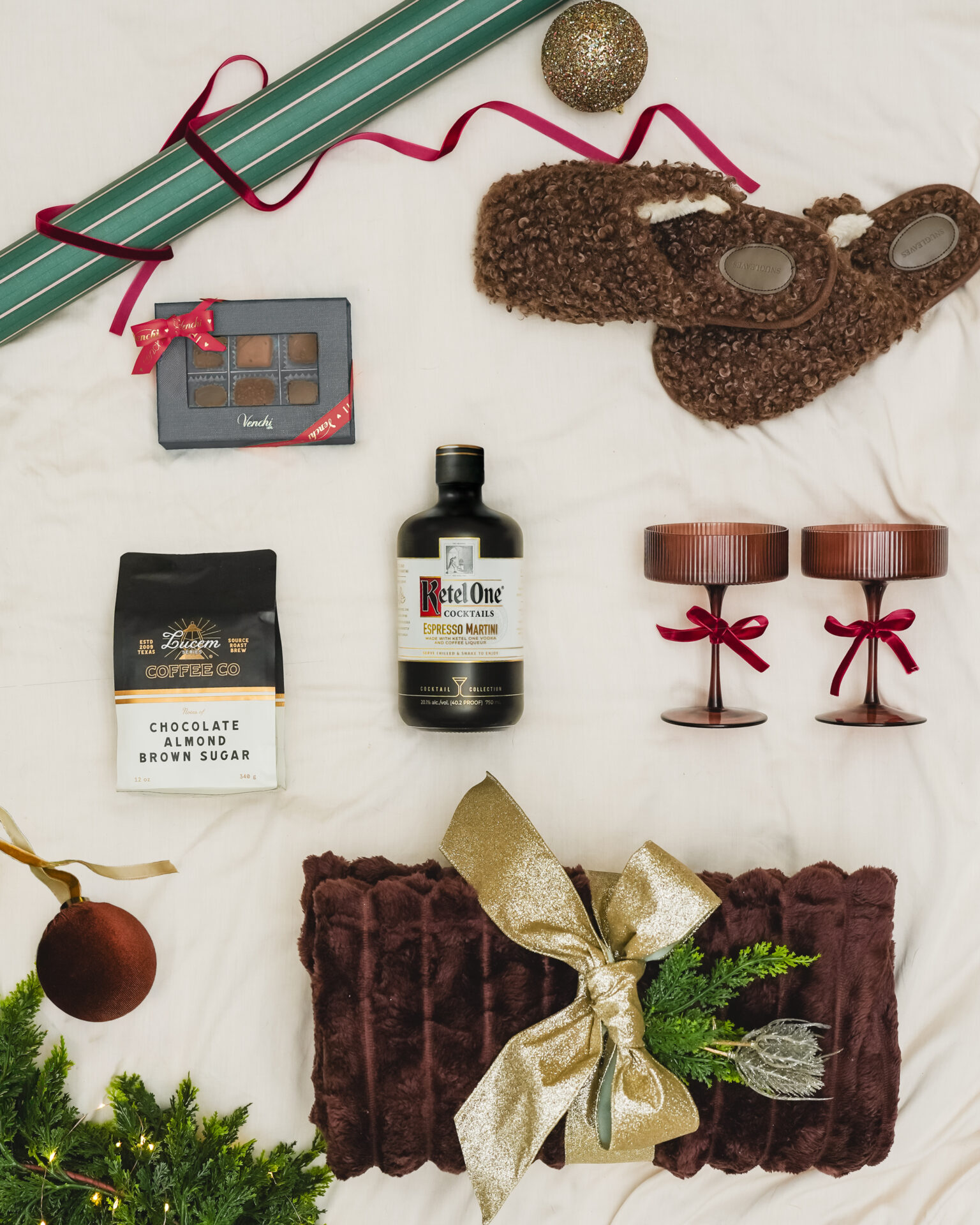A styled flat-lay of Christmas gifts featuring The Cocktail Collection