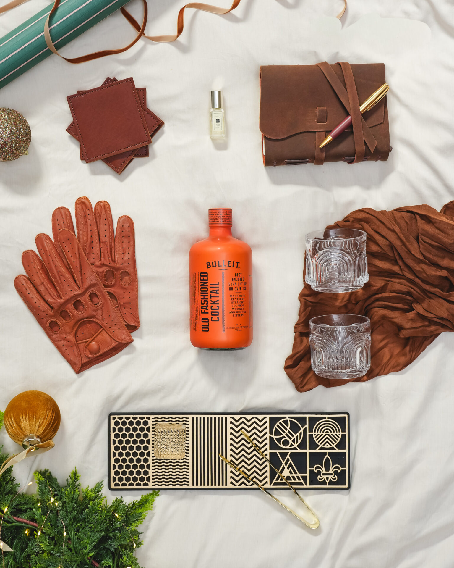 A styled flat-lay of Christmas gifts featuring The Cocktail Collection
