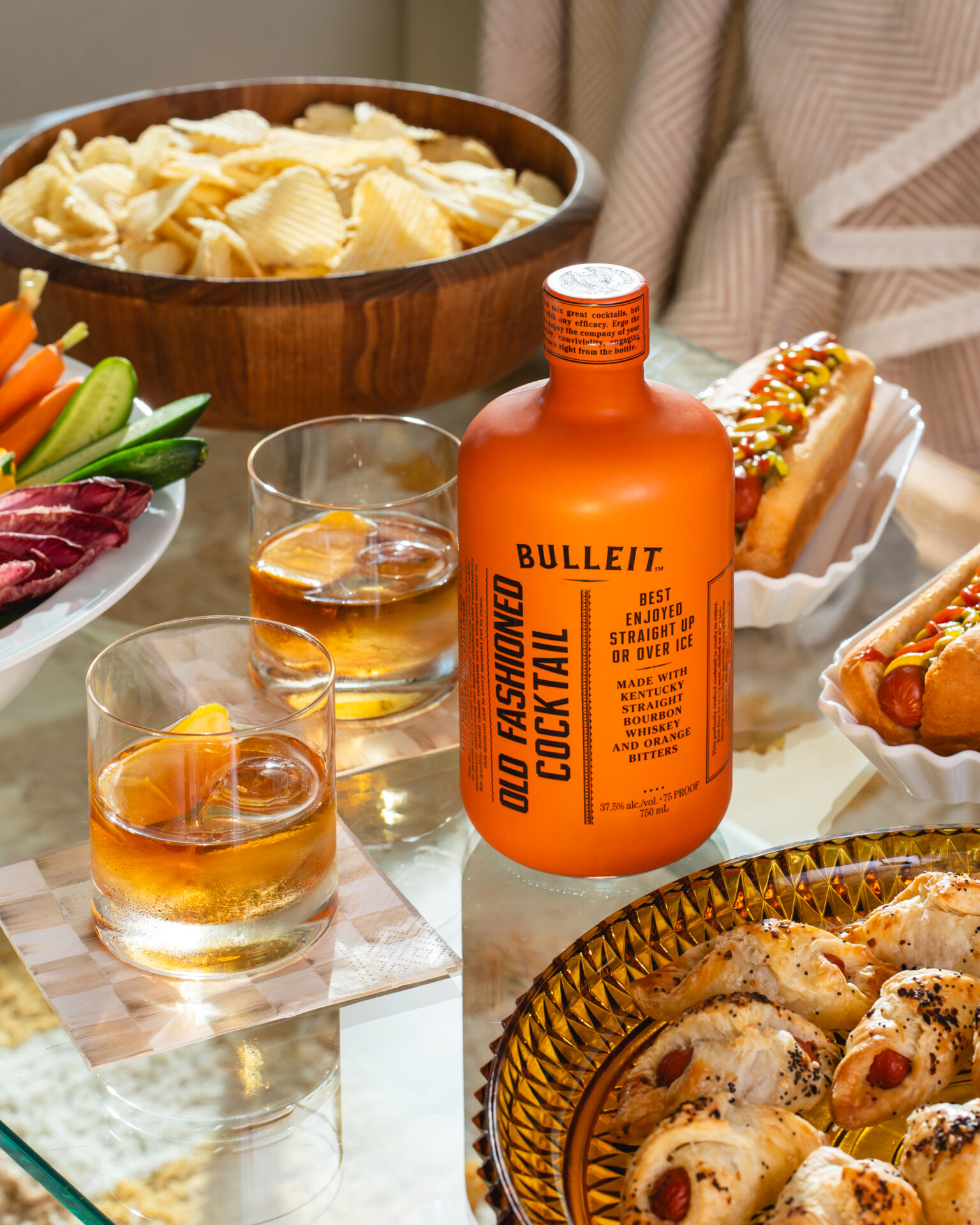 Bulleit whiskey sour on a table at a football party