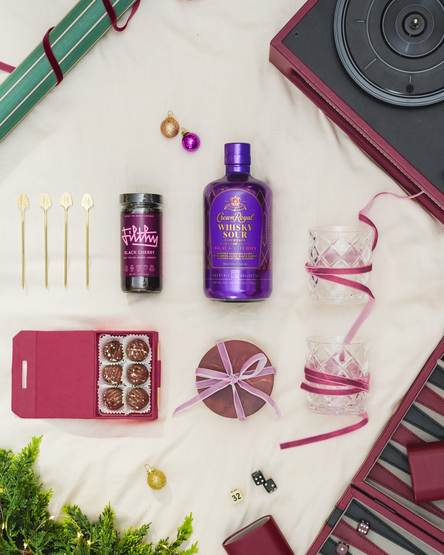 A flat-lay still-life photo of Crown Royal whiskey sour and other gift items