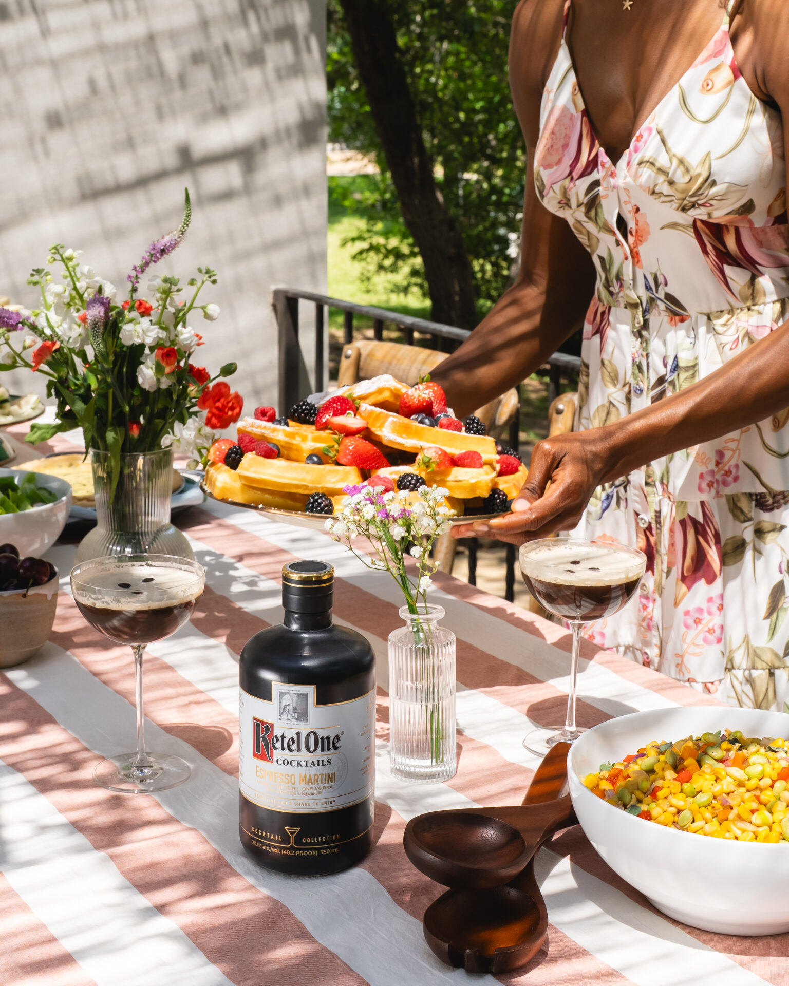 A bottle of The Cocktail Collection Ketel One espresso martini on a styled table