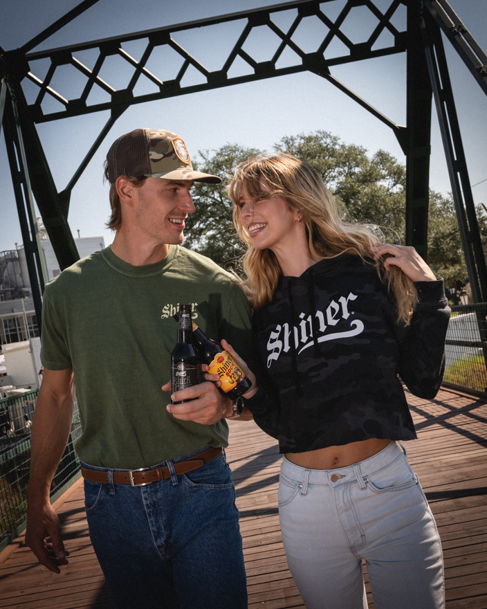 Models pose with Shiner Beer in Shiner Texas
