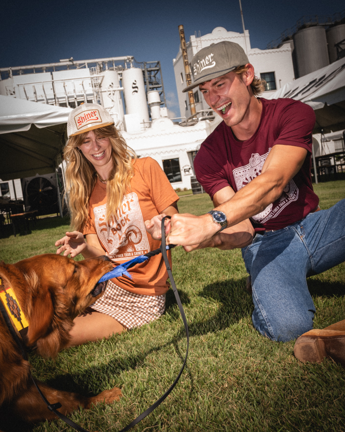 Models pose with Shiner Beer in Shiner Texas