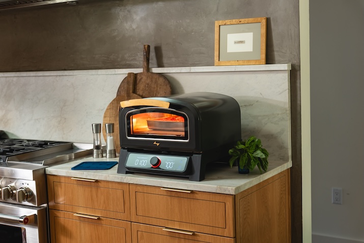 Lifestyle photography featuring the Current electric pizza oven